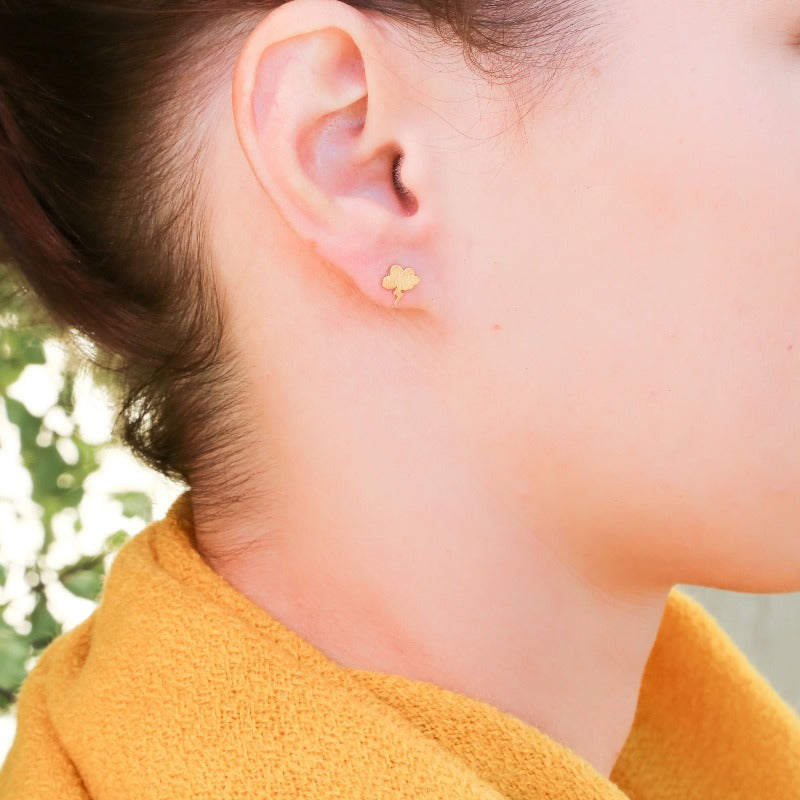 Gold Cactus Outline Earrings on Child ear
